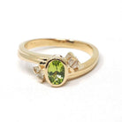 Peridot & Diamond Ring - Modern 14k Yellow Gold Oval Faceted Green Gemstone Bypass - Circa 2000s Era Size 6 August Birthstone Fine Jewelry