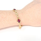 Rhodolite Garnet Bracelet - Modern Estate 14k Yellow Gold Purple Red Oval Faceted Natural Gemstones - Circa 2000s Era Love Knot Fine Jewelry