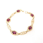 Rhodolite Garnet Bracelet - Modern Estate 14k Yellow Gold Purple Red Oval Faceted Natural Gemstones - Circa 2000s Era Love Knot Fine Jewelry