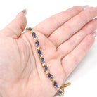 Iolite Tennis Bracelet - Contemporary 14k Yellow Gold Violet Blue Oval Natural Gemstone & Flower Links - Circa 2000s Era 7 1/4" Fine Jewelry