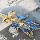 Vintage Bouquet Brooch - Retro Gold Wash On Sterling Silver Blue Glass Spray Pin - Circa 1940s Era Bow Leaf Motif Fashion Accessory Jewelry